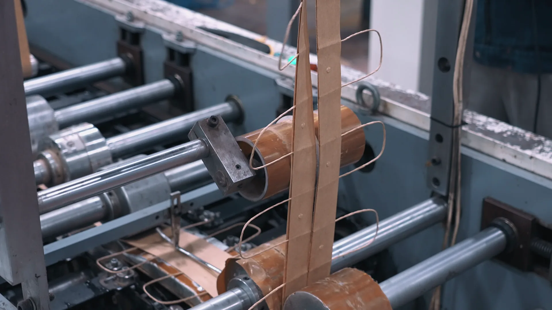 An automated line: paper running through the rollers